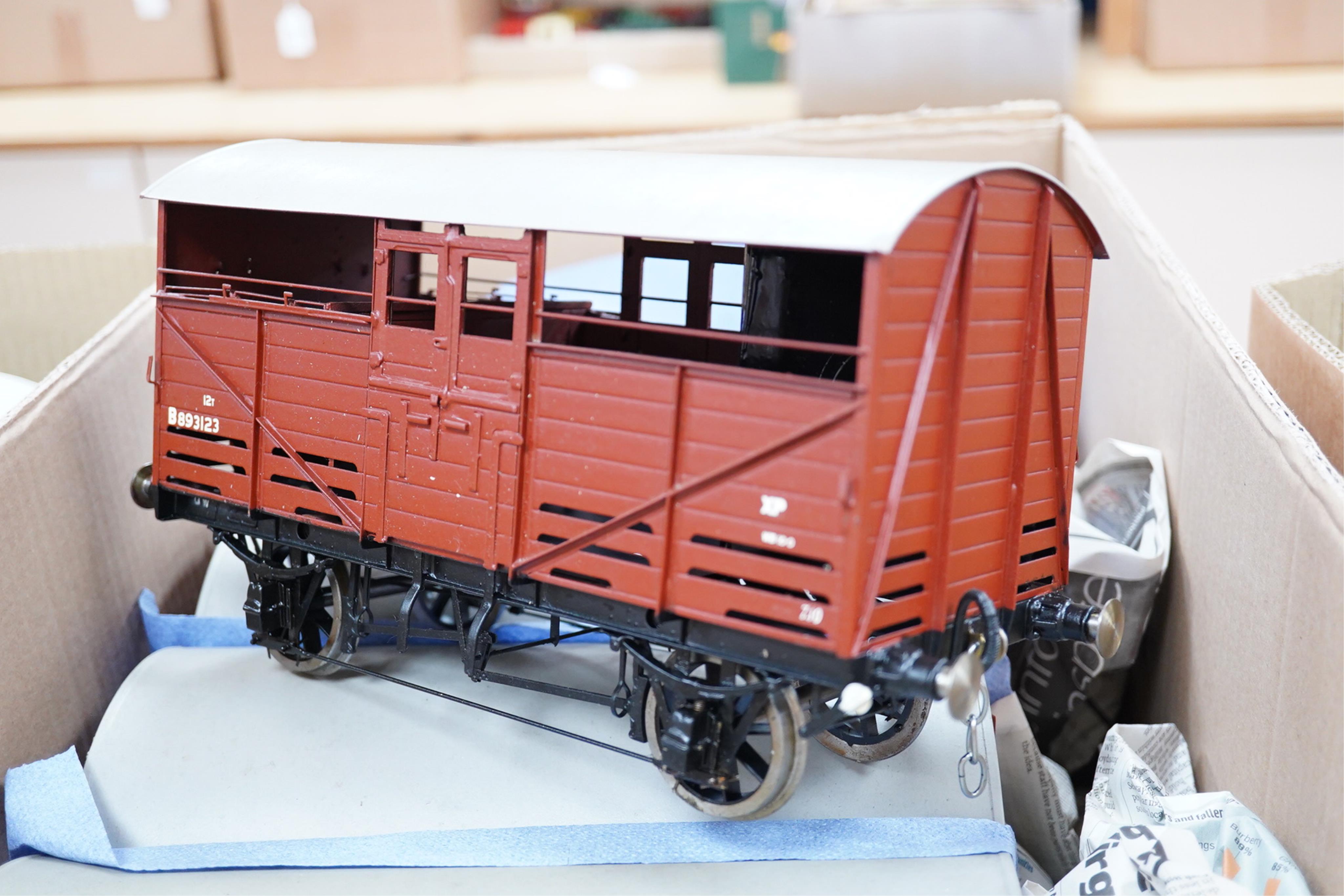 Six Gauge 3 model railway cattle trucks, of all metal construction built by Richard Toplis, well detailed and painted to a high standard